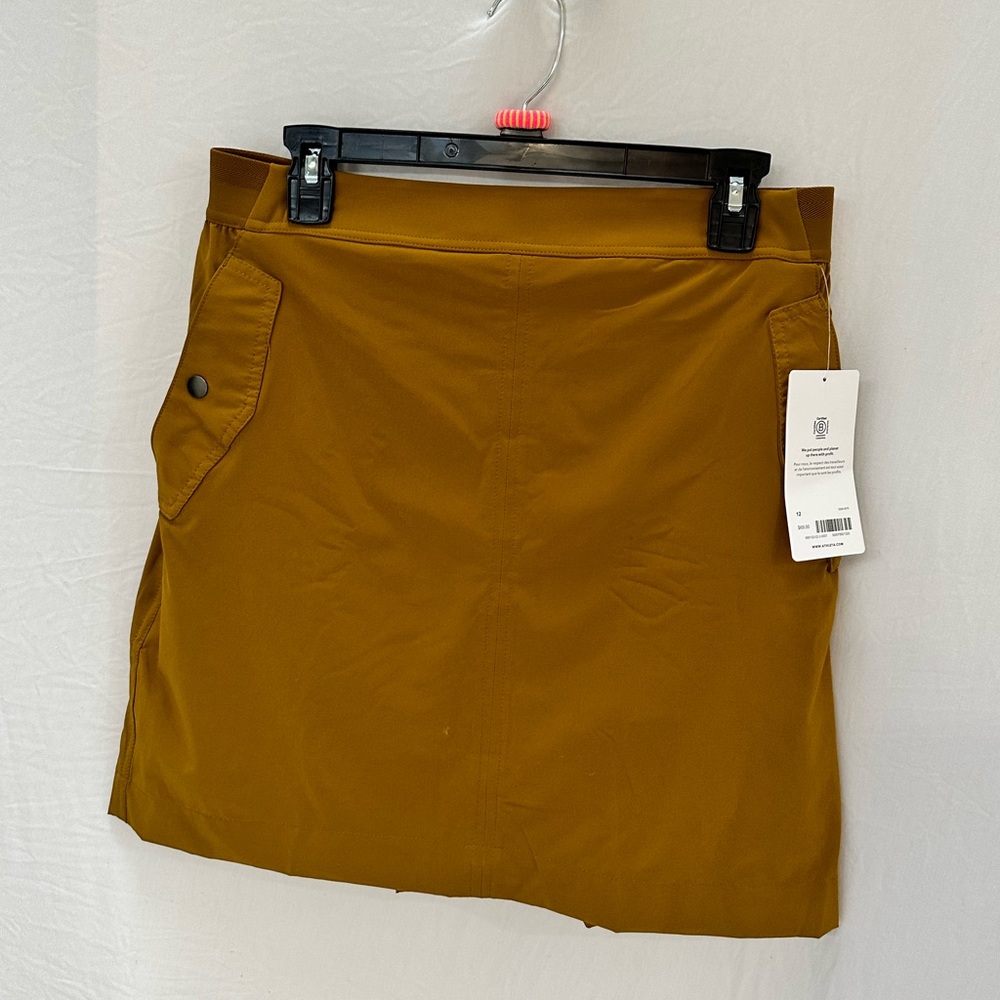 Atletha Skort. Dark mustard yellow.  NWT